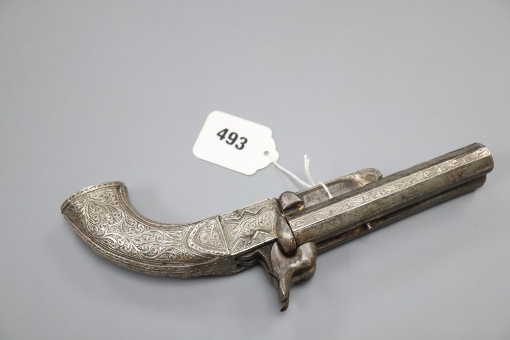 A 19th century Middle Eastern white metal mounted side by side double barrel box lock percussion pistol, 13cm barrels